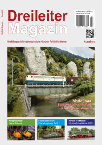 Titelbild des Dreileiter-Magazins, Ausgabe 9: Modelleisenbahnzug auf einer Brücke